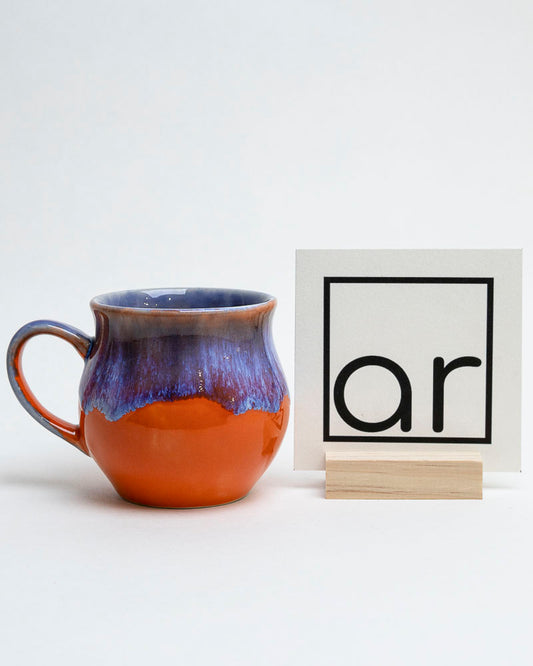 Kubek zachód nad glinianym brzegiem